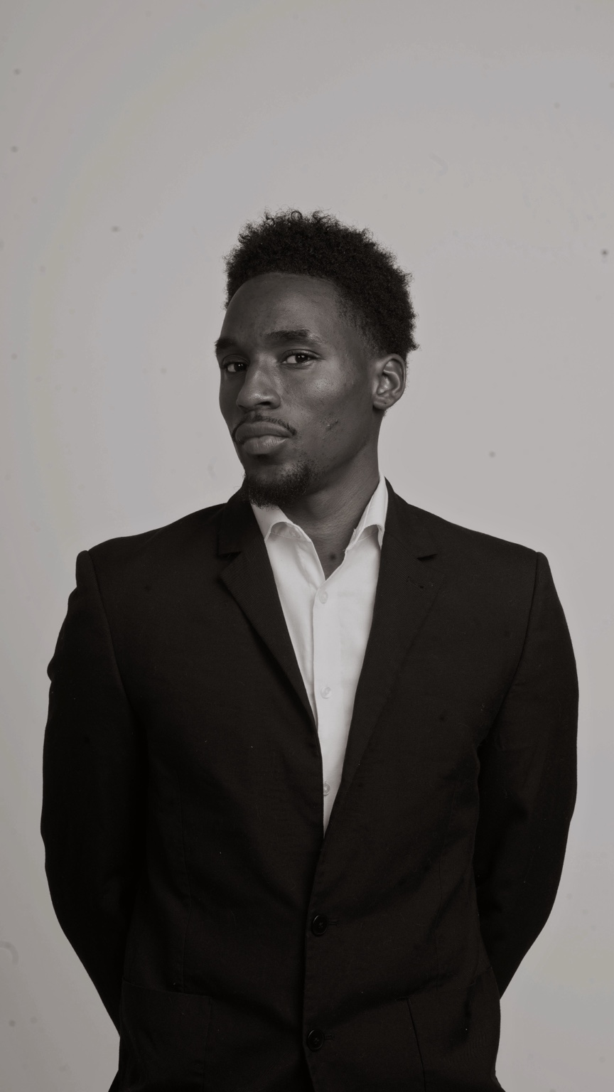 Kyyiren Terrell Sharp in a black suit portrait